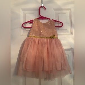 Holiday dress 6 months with gold sequins. Blush tool with a golden bow!